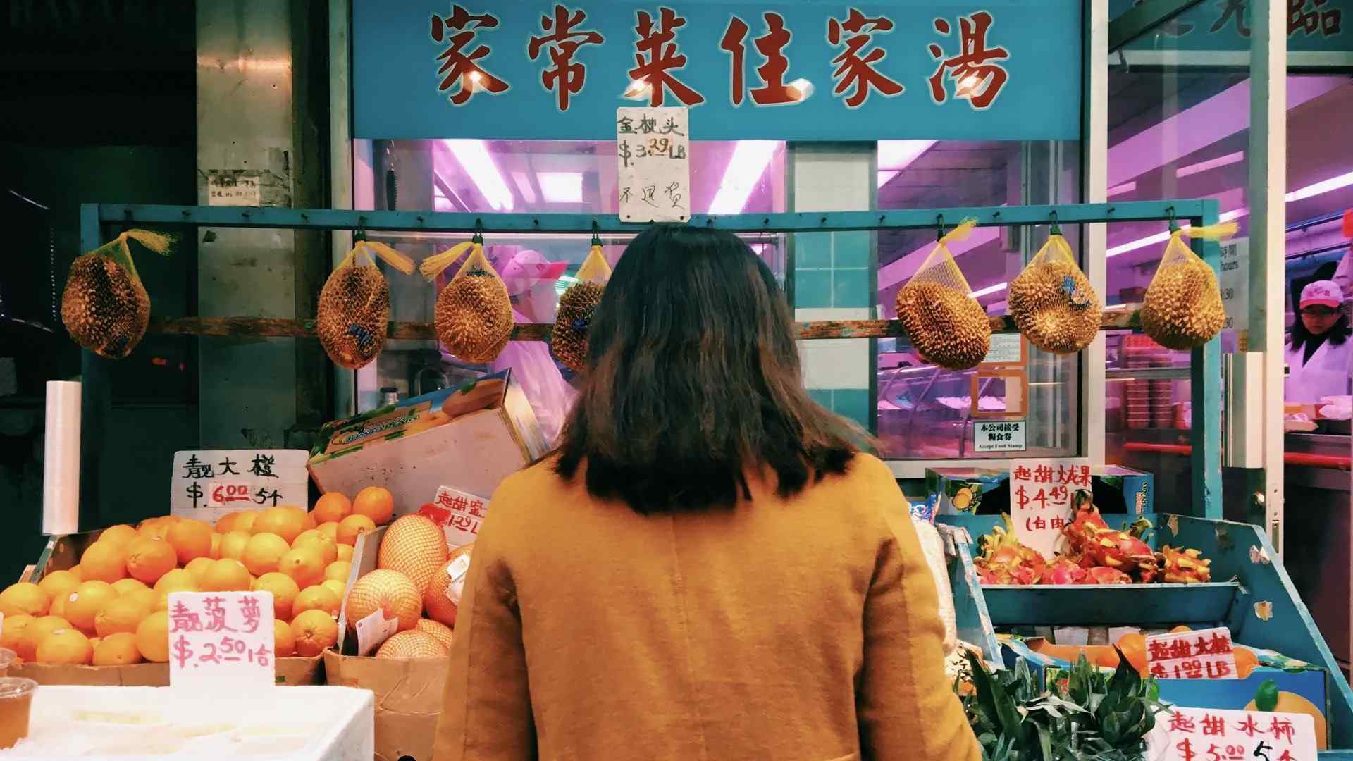 person outside a food market