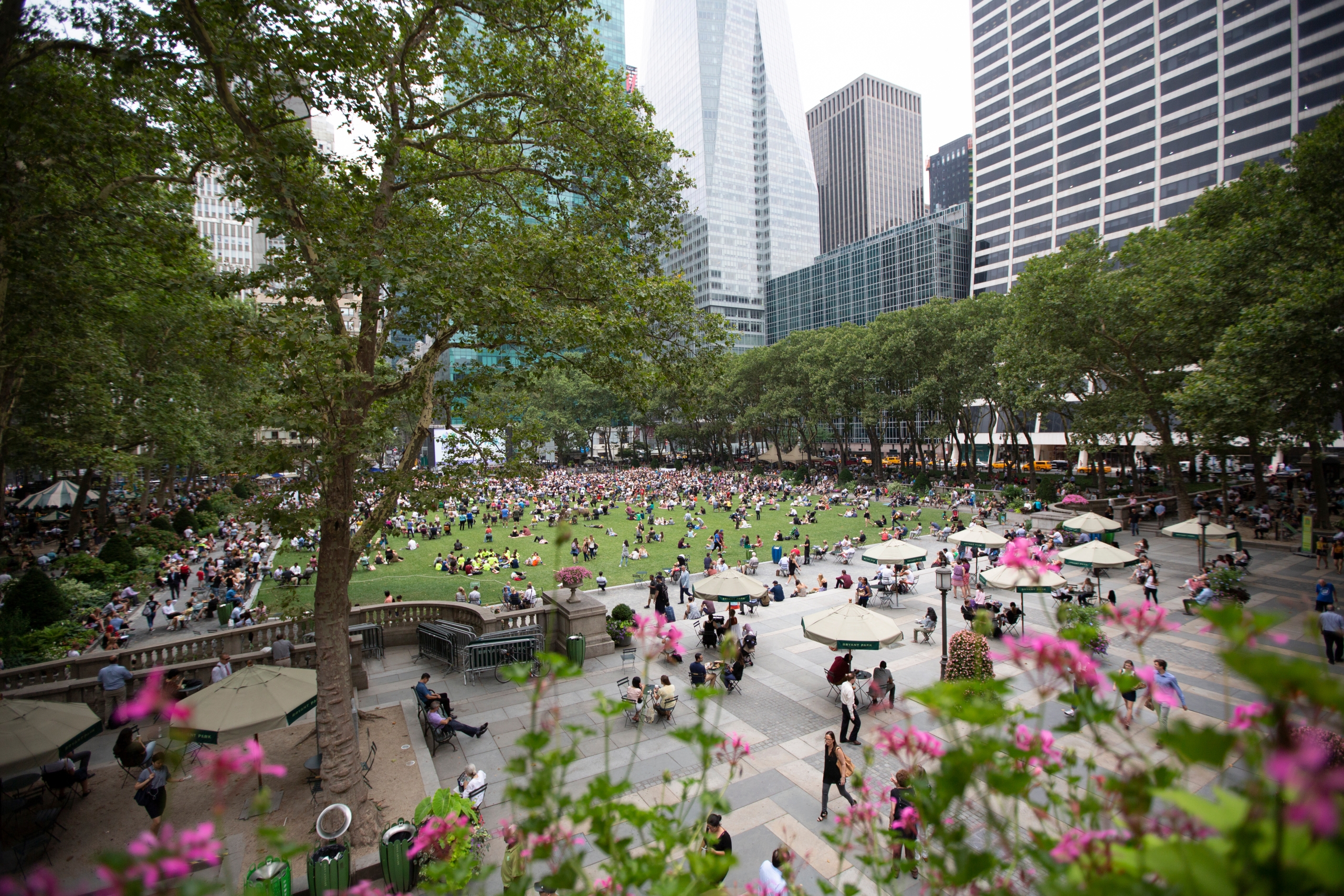 People visiting Bryant Park in the summer